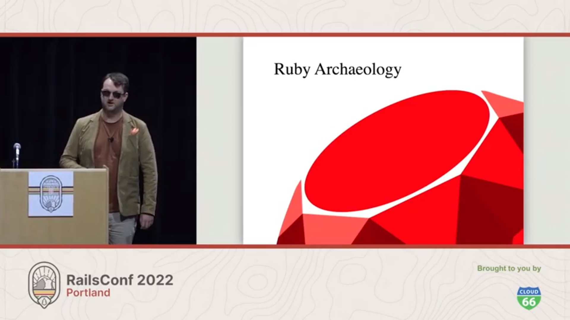 Nick Schwaderer giving a Ruby Archaeology talk on RailsConf 2022